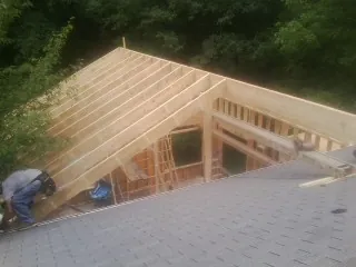 Framing a new roof addition that ties into an existing shingle roof in Stovall